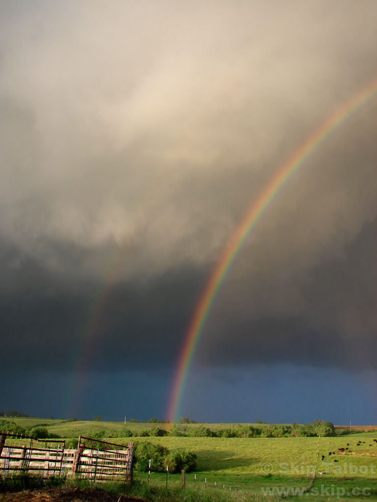 A double rainbow on the backend of a severe thunderstorm
